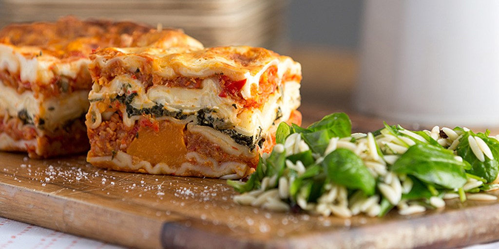 Pumpkin and red lentil lasagne with risoni salad. Photo: Let Them Eat