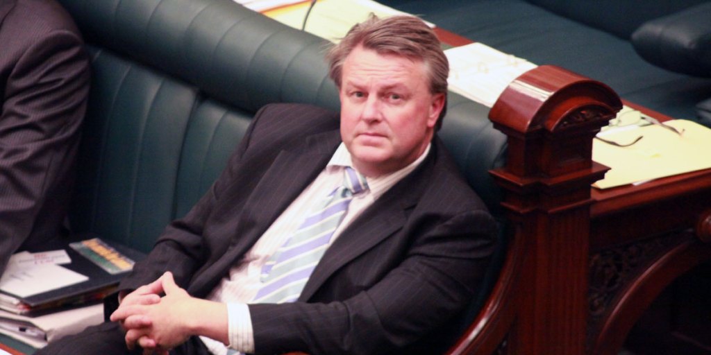 Iain Evans has gone - but not without one last slap at a factional rival.
