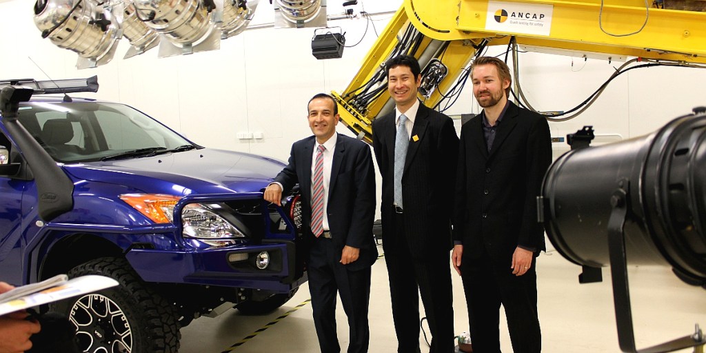 Road Safety Minister Tony Piccolo (left) with Adelaide University researchers Jeremy Woolley (centre) and Sam Doecke (right) in a crash test laboratory in Kent Town.
