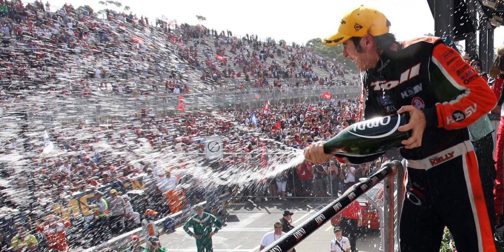 Good booze, bad booze: onlookers get an alcohol shower in the parklands after the Clipsal 500.