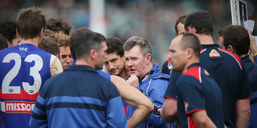 Another one goes: Bulldogs coach Brendan McCartney (centre) has resigned.