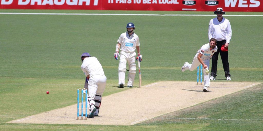 Chadd Sayers beats Rob Quiney's bat, as Chris Rogers looks on. Photo: Peter Argent