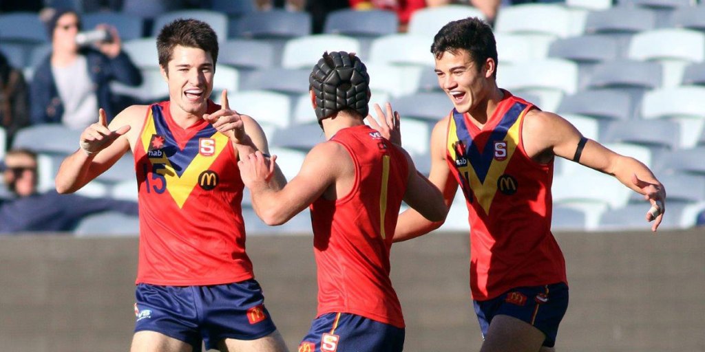 Young guns: Alex Neal-Bullen (left), Caleb Daniel and Billy Stretch celebrate a goal during the Under 18s championships at Simonds Stadium. Photo: Peter Argent 