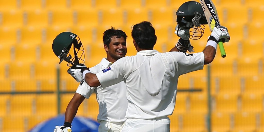 Pakistani batsmen Azhar Ali (right) and Misbah Ul Haq congratulate each other after both scoring a century during the fourth day of the second Test.