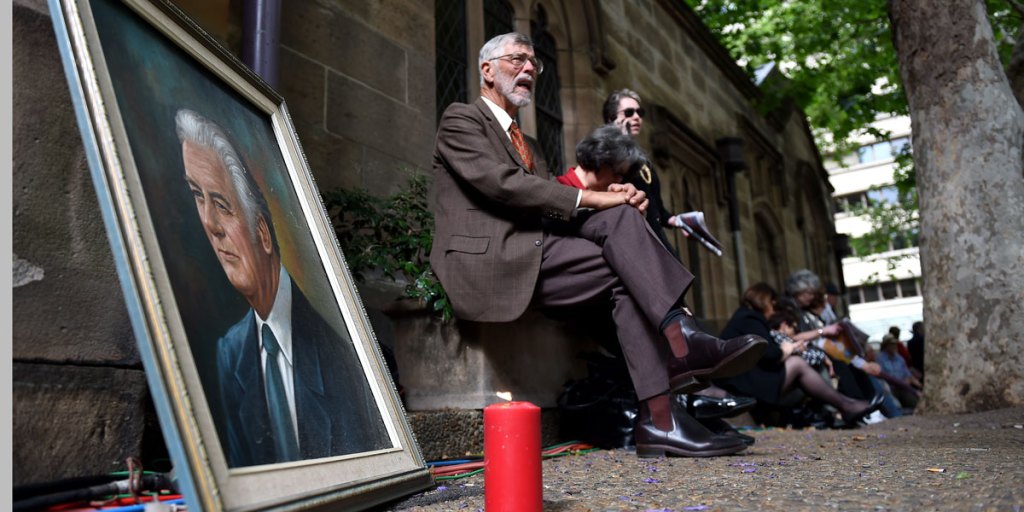 A portrait of Gough Whitlam outside Sydney Town Hall, where crowds have gathered for his state memorial service.