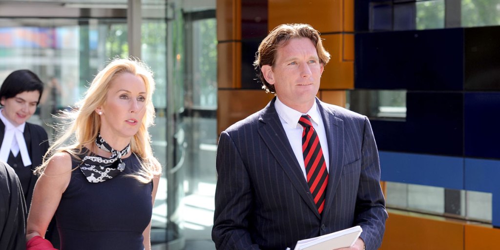 Essendon coach James Hird and wife Tania walk out of the Federal Court after the day's session in Melbourne on Monday.