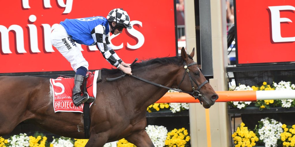Protectionist ridden by jockey Ryan Moore crosses the finish line to win the Melbourne Cup.