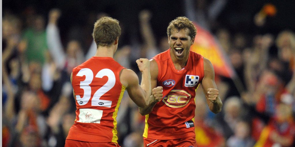 Nathan Krakouer celebrates a goal while playing for Gold Coast.