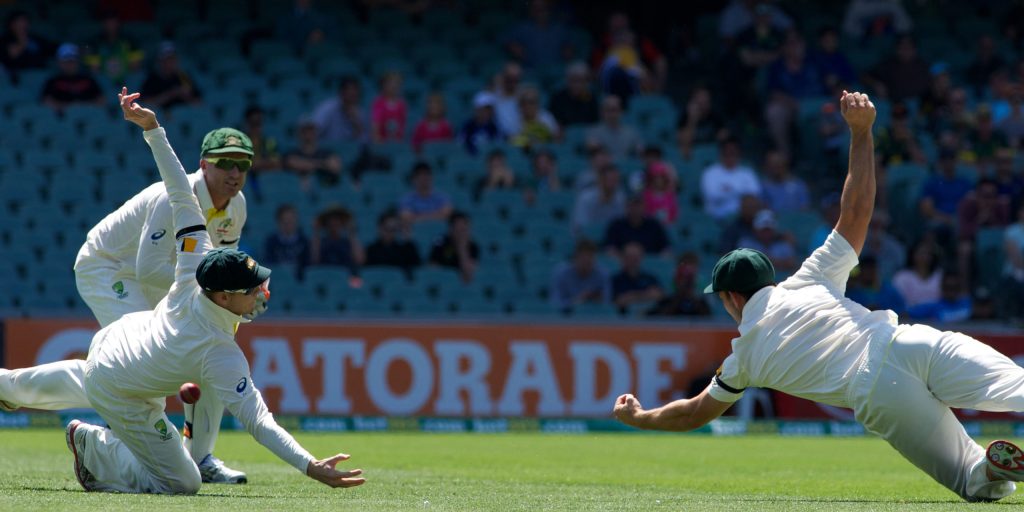Mitch Marsh (right) drops a tough chance. Photo: Michael Errey/InDaily