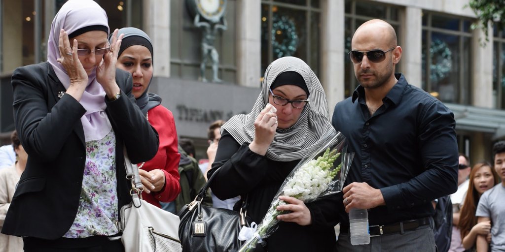 Members of the Muslim community lay flowers in Martin Place.