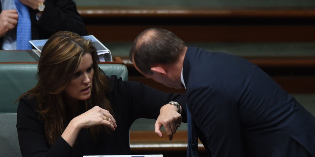 Prime Minister Tony Abbott speaking with his chief of staff Peta Credlin in Parliament in 2014.