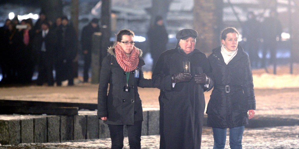 Auschwitz survivor Roman Kent lights a candle at the International Monument to the Victims of Fascism at the site of the former Nazi concentration and extermination camp KL Auschwitz-Birkenau.