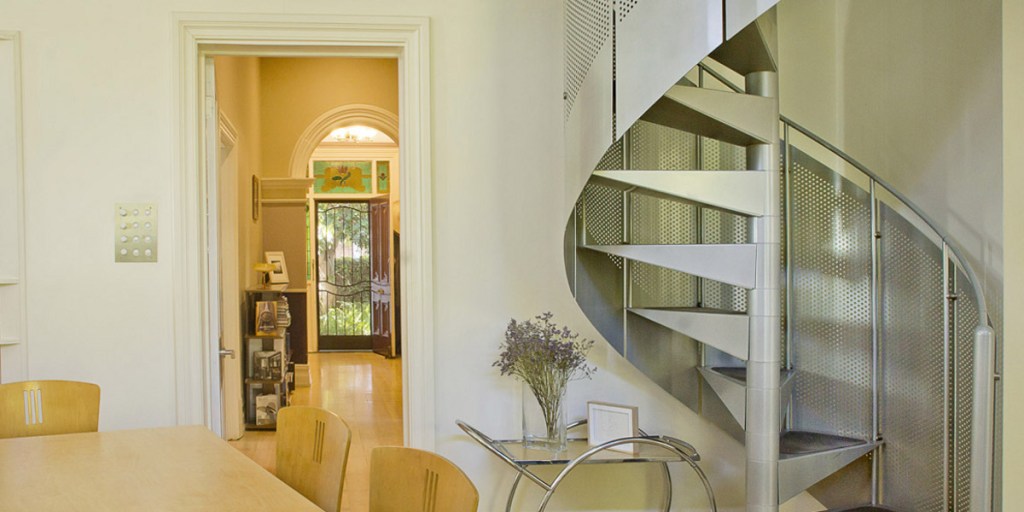 A spiral staircase now connects to an upstairs home office.