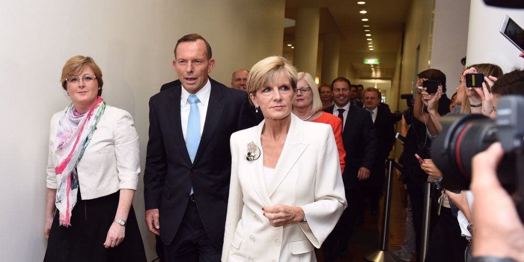 Prime Minister Tony Abbott (C) and Minister for Foreign Affairs Julie Bishop (R) arrive for the Liberal party room meeting.
