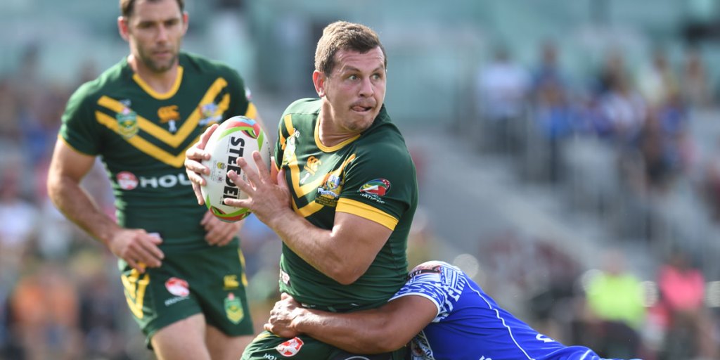 Australian rugby league star Greg Bird (with ball in hand). 
