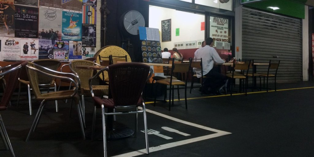 Malacca Corner's tables must be within the yellow line drawn by Market management.