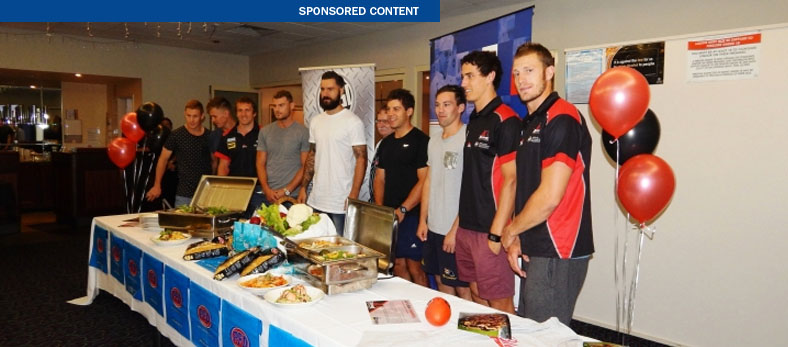 West Adelaide FC players at the launch of their new menu last night, which was developed with the help of Flinders University nutritionists Annabel Murphy and Dr Kathryn Jackson. 