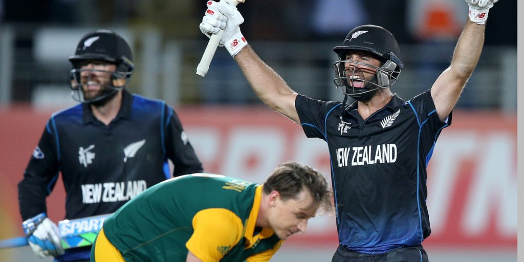 New Zealand’s Grant Elliott celebrates with teammate Dan Vettori as South Africa's Dale Steyn reacts after Elliott smashed a six to give the Black Caps victory.