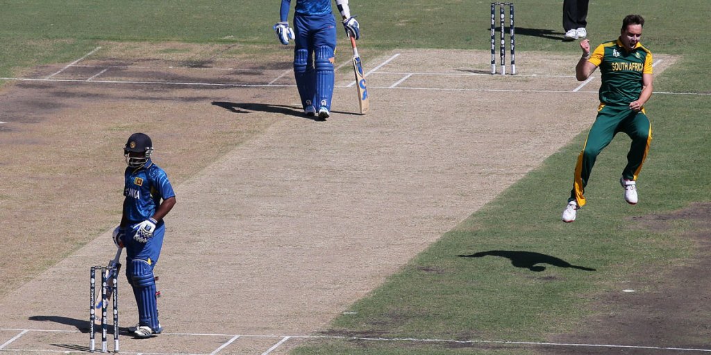 South Africa's Kyle Abbott celebrates after taking the wicket of Sri Lanka's Kusal Perera.