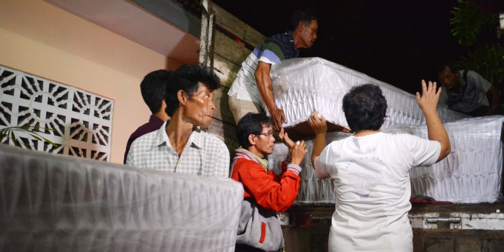 Undertakers with coffins prepared for death row inmates in Nusakambangan island, including Australian's Andrew Chan and Myuran Sukumaran.