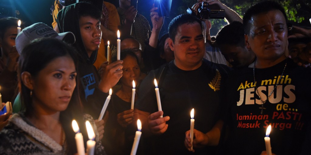 Supporters from Andrew Chan's church hold a vigil at the port opposite Nusakambagan Island Prison overnight.