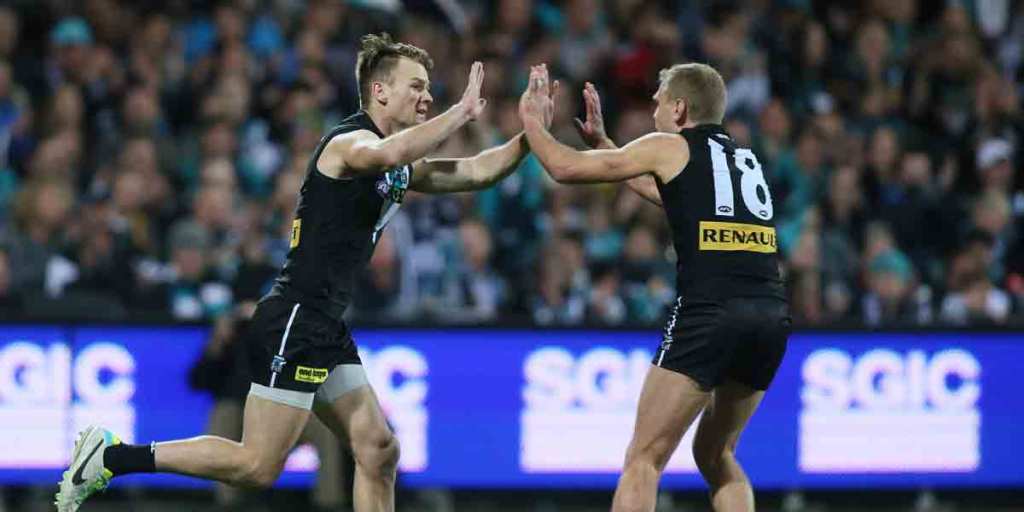 Port Adelaide veteran Kane Cornes (right) has been "rested" after only two rounds.