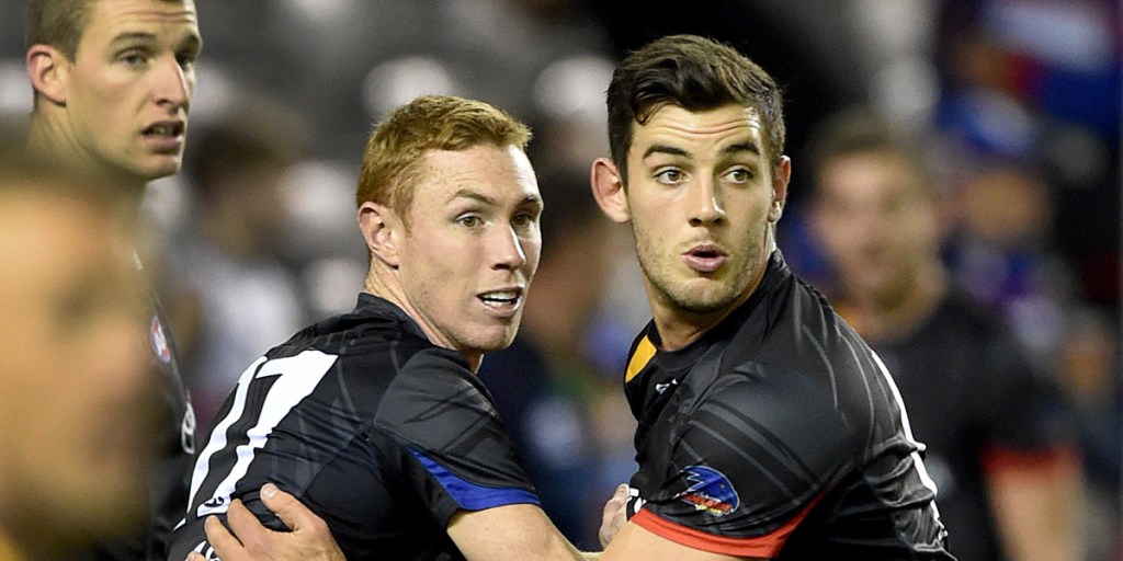 Taylor Walker with Tom Lynch in the warm-up before it all went wrong against the Bulldogs.