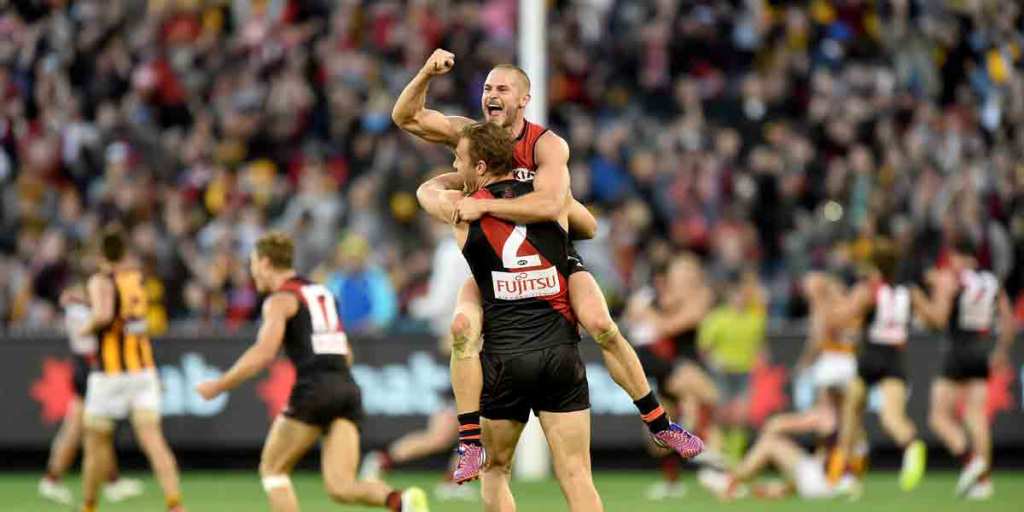 David Zaharakis celebrates with Tom Bellchambers after the Bombers' win against Hawthorn.