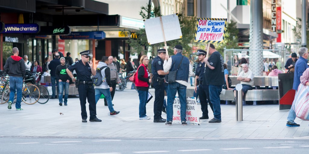 Police questioning protestors in Rundle Mall yesterday. Photo: Nat Rogers/InDaily