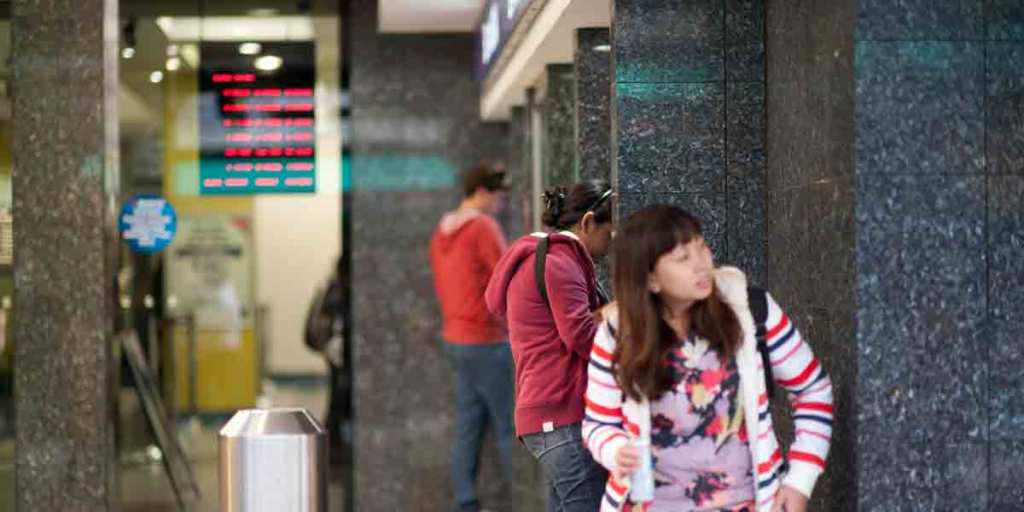 BankSA customers use ATMs in Adelaide. 