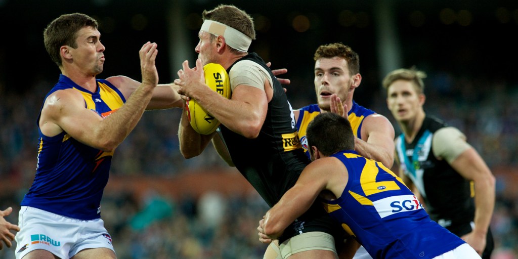 Brad Ebert under pressure from the West Coast players. Photo: Michael Errey/InDaily