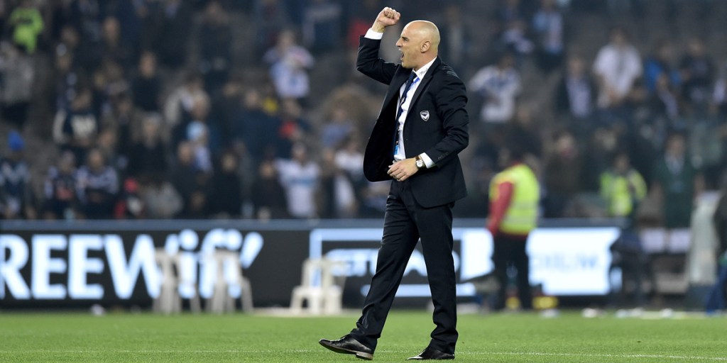 Melbourne Victory coach Kevin Muscat celebrates with fans after his side's win over crosstown rival Melbourne City.  