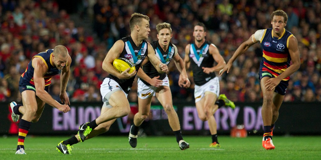 Robbie Gray leaving Scott Thompson in his wake. Photo: Michael Errey/InDaily