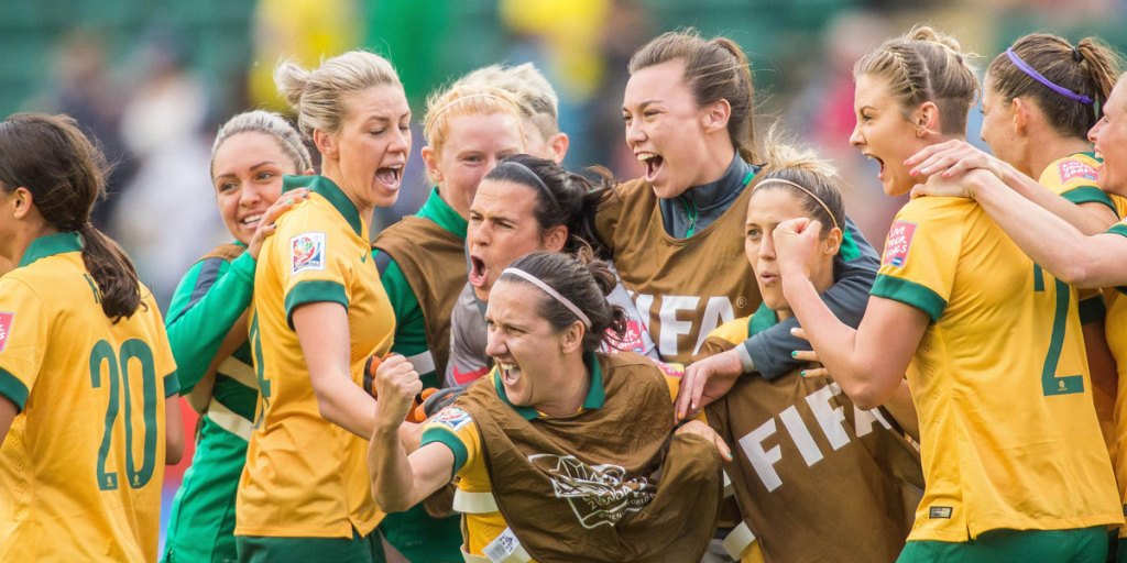 Jubilant Matildas players celebrate after their 1-1 tie with Sweden.