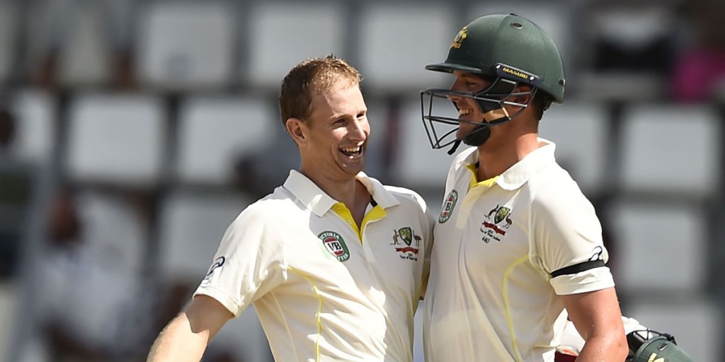 Adam Voges (left) celebrates his century with Josh Hazlewood.