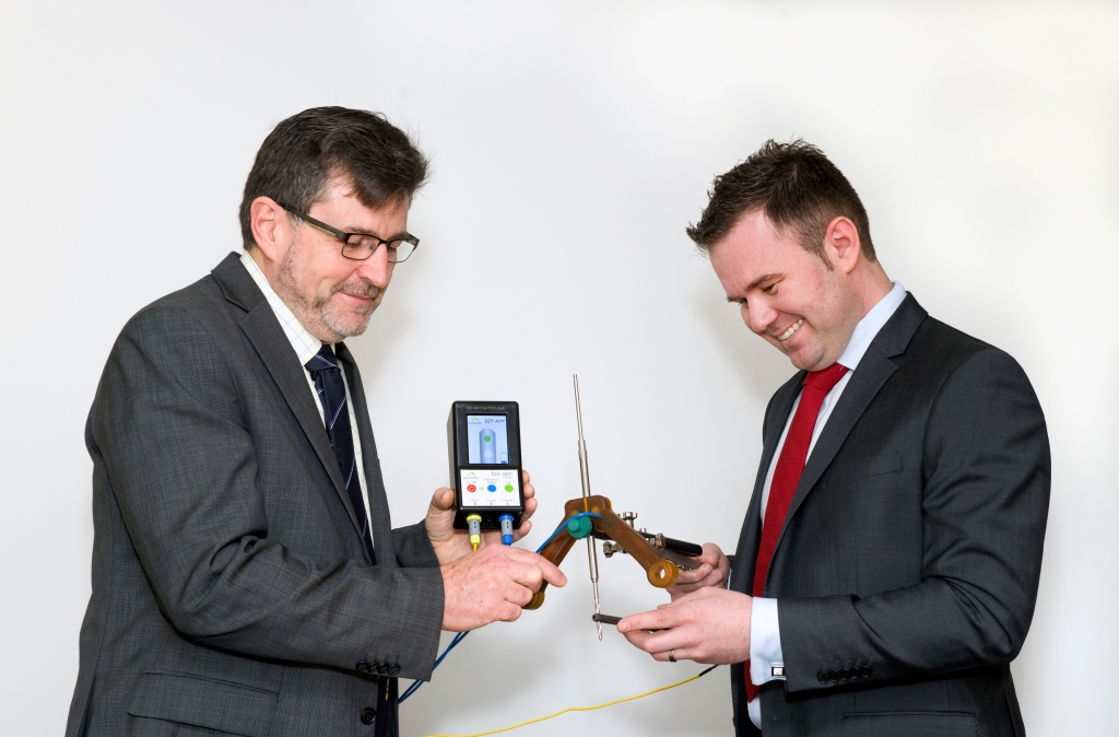Geoff Cottrell, from Flinders University, on the left and Chris Henry, General Manager for Austofix, on the right, with the EzyAim product.