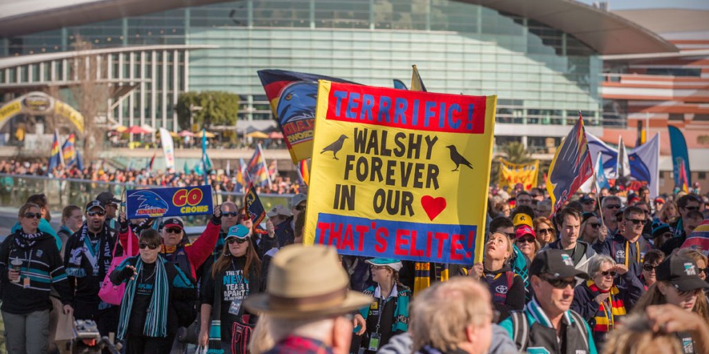Huge numbers of fans cross the footbridge before Sunday's Showdown.