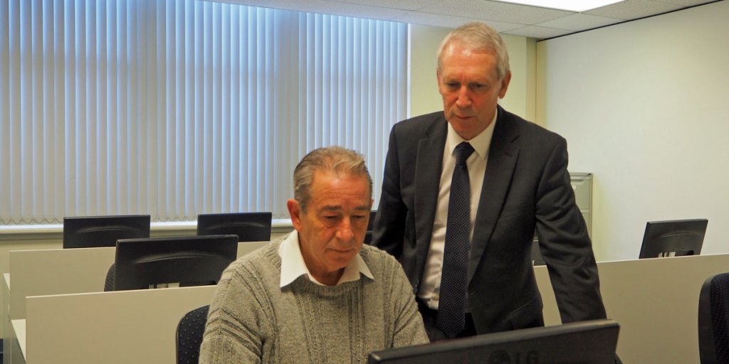 DOME executive director Greg Goudie (right) assisting 61-year-old volunteer Michael Oates (left), who says he has applied for more than 40 jobs without securing a single interview.