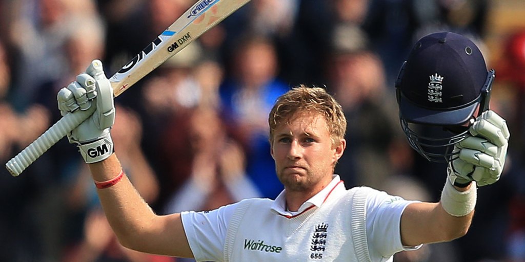 Joe Root celebrates his century.
