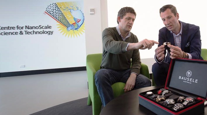 Bausele Australia founder Christophe Hoppe, right, discusses the new Bauselite watch with Flinders University nanomaterials and polymers expert Dr Jonathan Campbell at the University's Tonsley facility. 