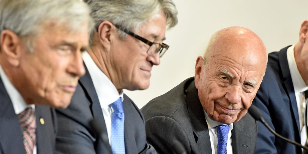 Rupert Murdoch (right) joins AFL commission chairman Mike Fitzpatrick (centre) and the Seven Network's Kerry Stokes (left) to announce a new AFL broadcast deal.