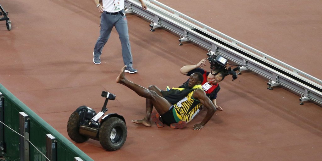After winning the 200m final, Usain Bolt was run into by a TV cameraman on a Segway.