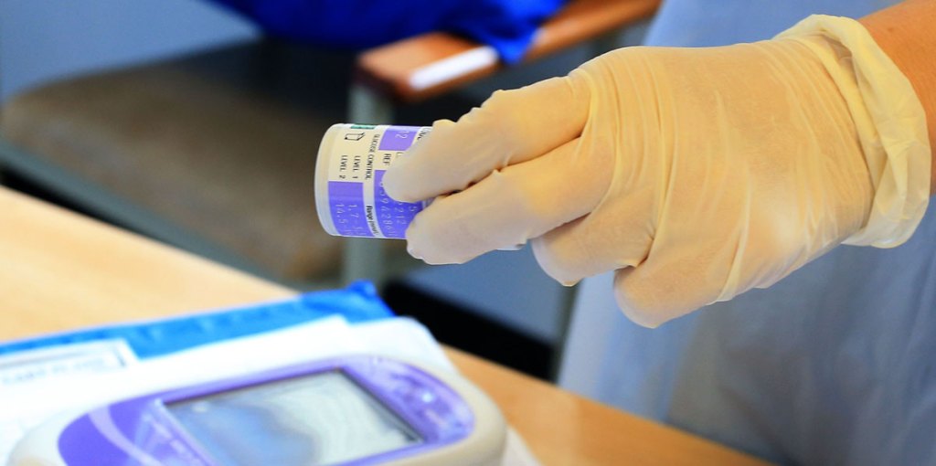 A nurse testing a patient for type 1 diabetes.
