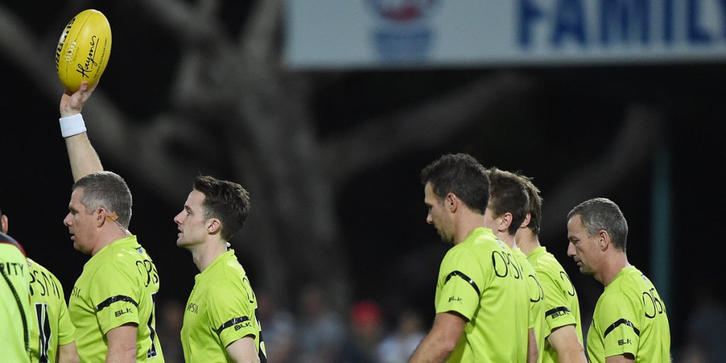 Too much? The AFL will trial four field umpires in a regular season match on the weekend.