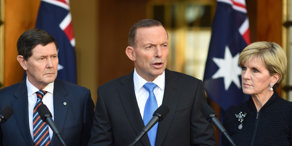 Prime Minister Tony Abbott addresses the media this morning, flanked by Defence Minister Kevin Andrews and Foreign Minister Julie Bishop.