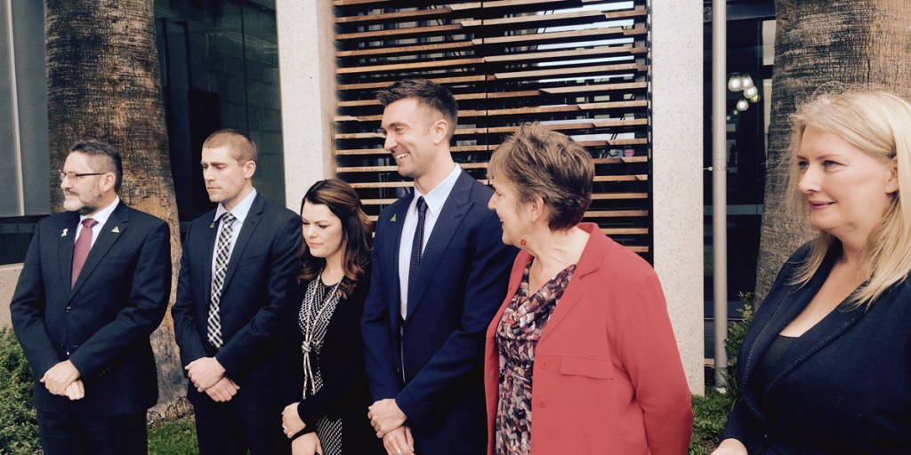 Incoming senator Robert Simms (centre) with outgoing senator Penny Wright (immediately right) and his new colleagues.