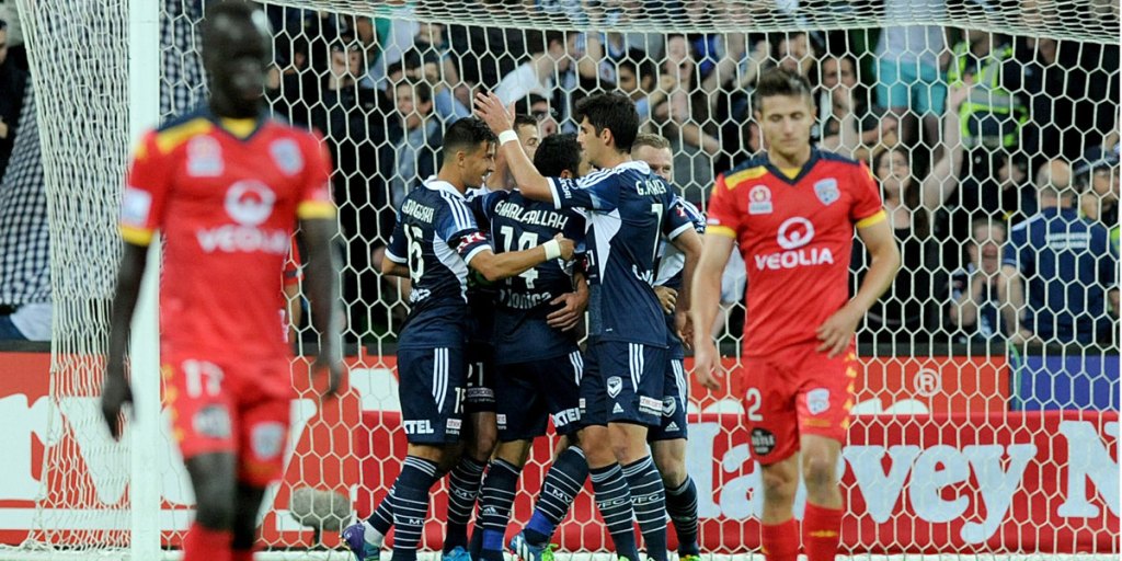 Melbourne Victory players celebrate a goal during the 2014/15 season. AAP image