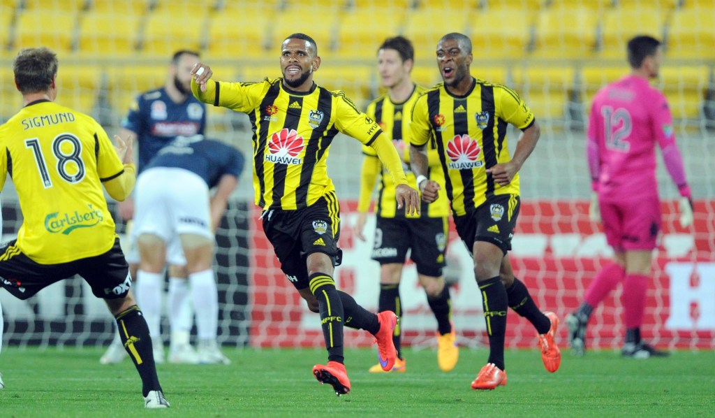 Wellington Phoenix's Kenny Cunningham (centre) celebrates after scoring a goal during against the Central Coast Mariners.