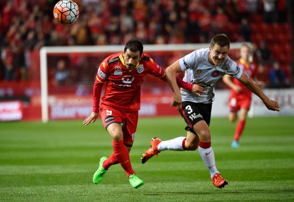 Adelaide's Sergio Cirio and Western Sydney's Scott Jamieson contest the ball.