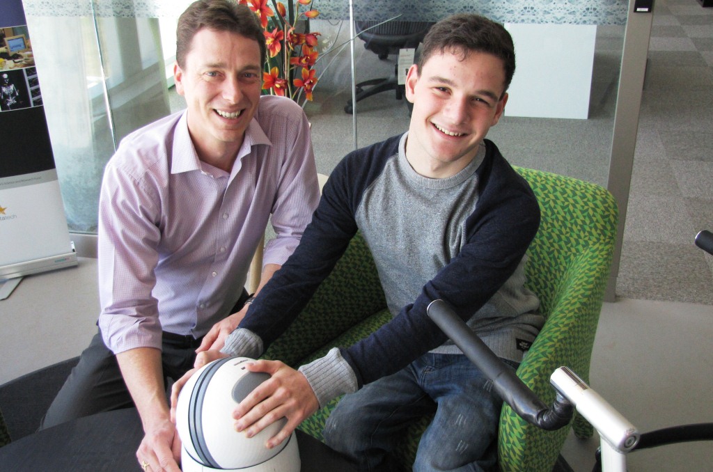 Flinders University Rehabilitation Engineer David Hobbs with Alexander Arthur at Flinders' Tonsley facility this week. 
